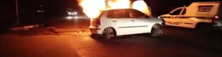 A car stolen from foreigners is burnt in Johannesburg by xenophobic South Africans