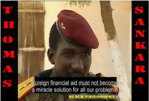 Closeup picture of Captain Thomas Isidore Sankara in military fatigues and a red beret with a star on his head. The subtitles on the screen read 