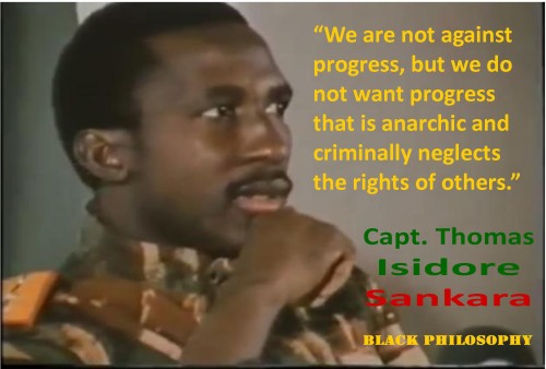 Medium closeup picture of Captain Thomas Sankara wearing military fatigues. The quote “We are not against progress, but we do not want progress that is anarchic and criminally neglects the rights of others.” appears in the picture.