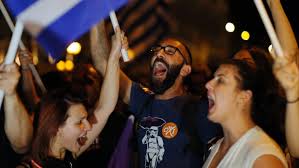 Image of Greek revellers partying and celebrating outside Parliament in Greece.